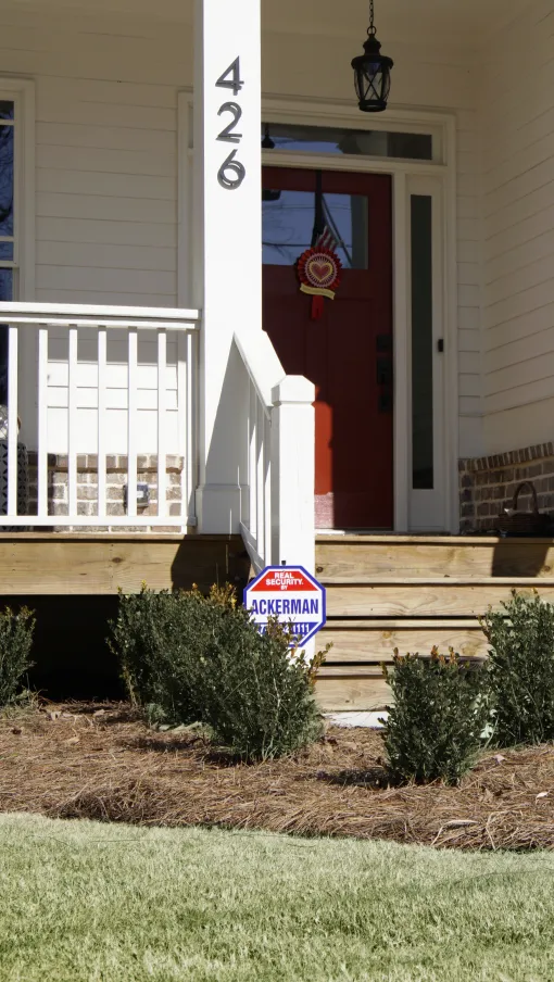 a house with a flag on the porch