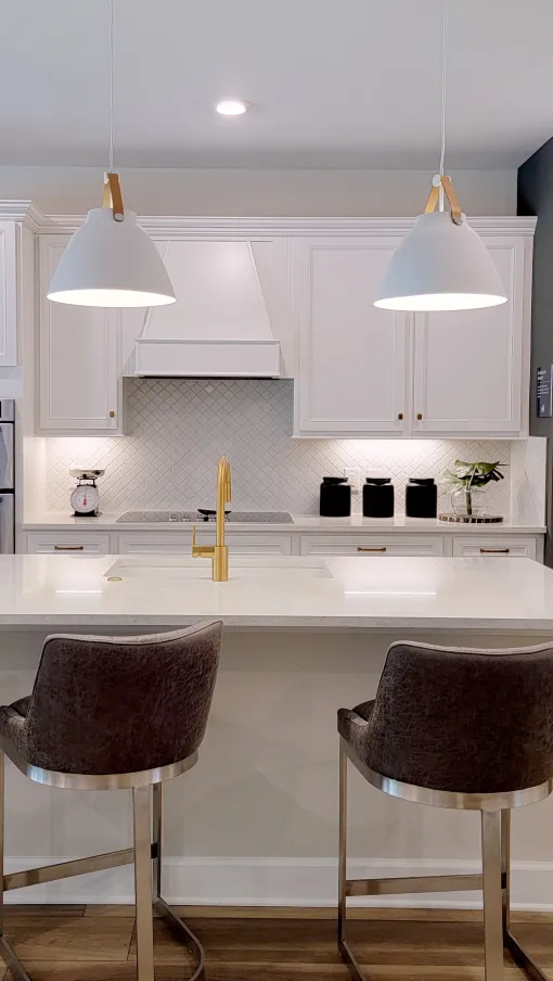 a kitchen with white cabinets