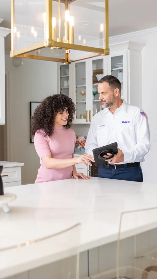 a man and a woman in a kitchen