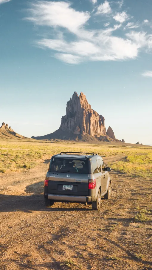 a car driving on a dirt road