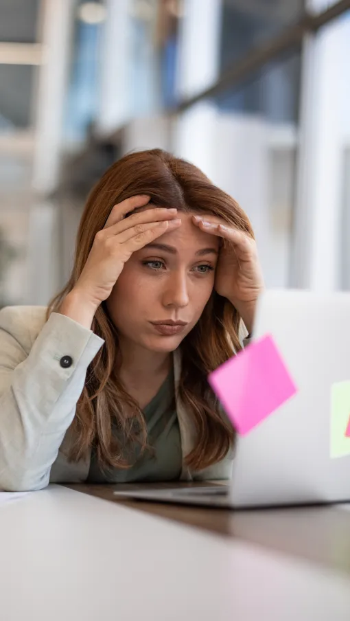 a person looking at a laptop