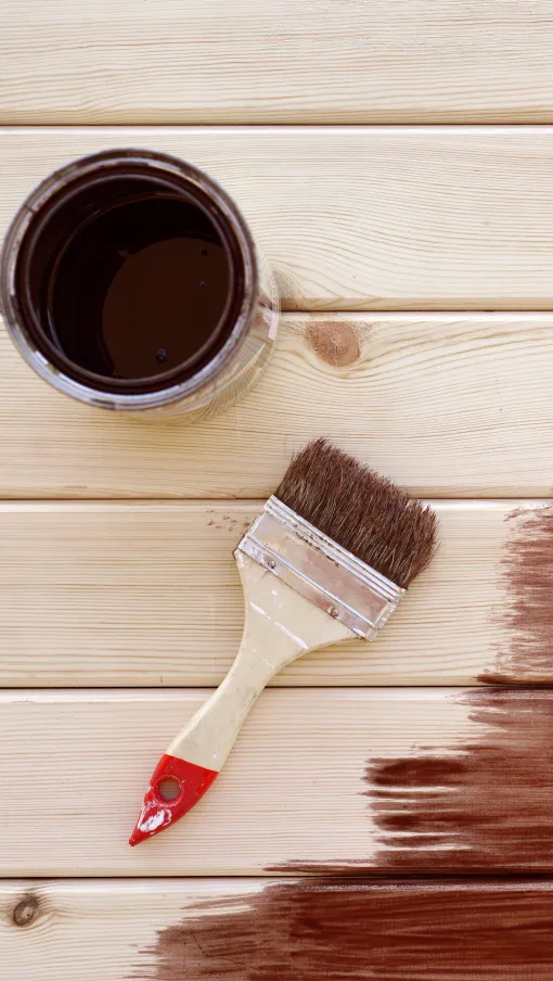 a paintbrush on a deck