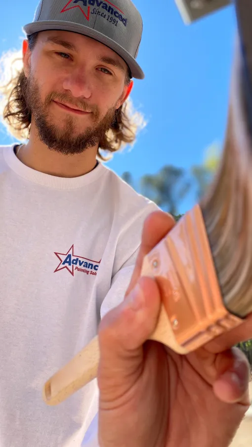 a person holding a paint brush