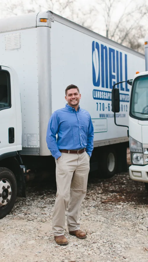 a man standing in front of a white truck