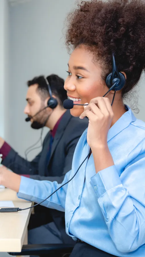 a person wearing headphones and sitting at a desk