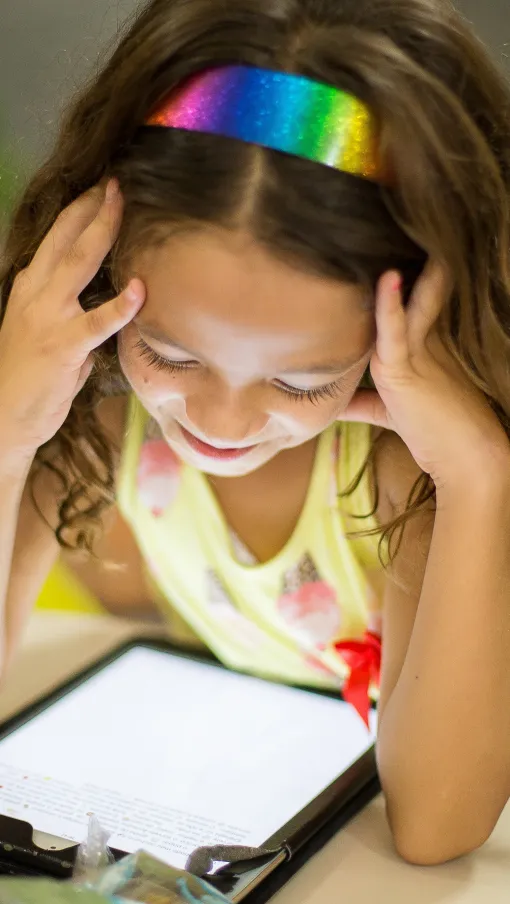 girl playing on tablet