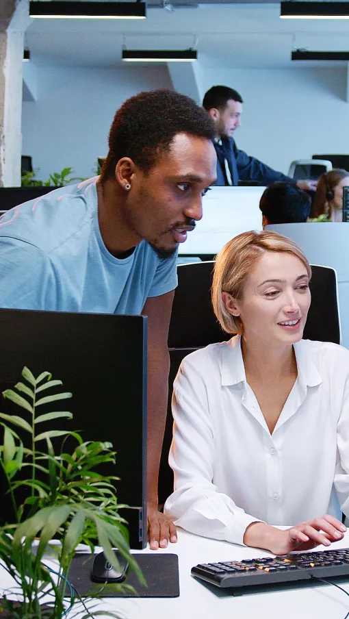 a group of people working in an office