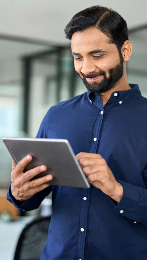 a man holding a tablet