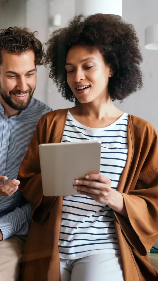 a few people looking at a tablet