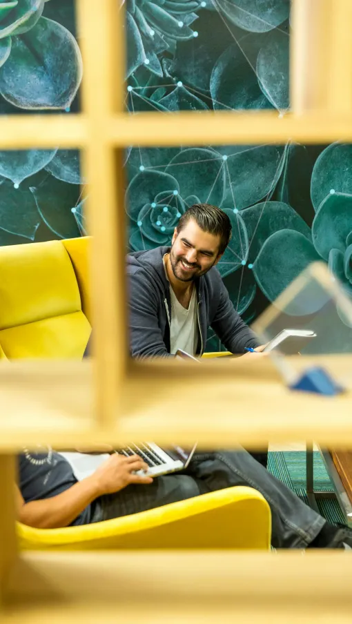 Mehdi Taremi et al. looking at a computer screen