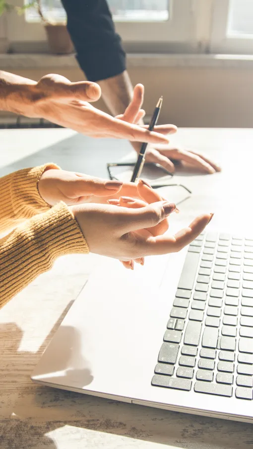 a few people working on a laptop