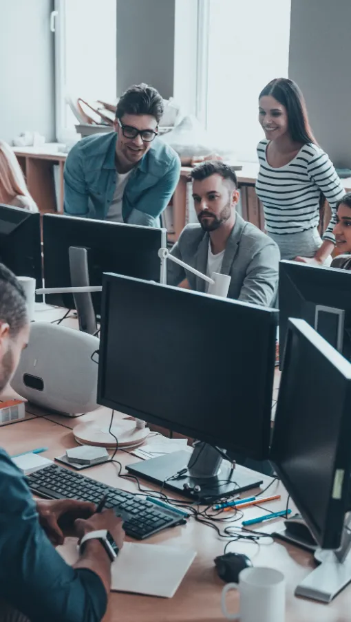 a group of people sitting at computers