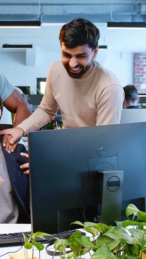 Mehdi Taremi et al. looking at a computer screen