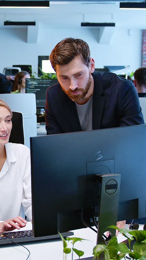 a group of people working in an office