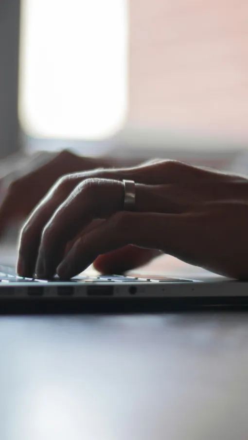 a person typing on a laptop