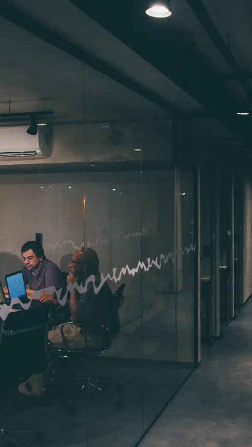 a group of people working at computers