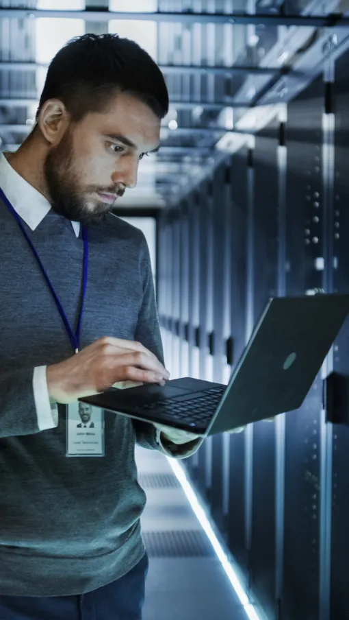 a man holding a laptop