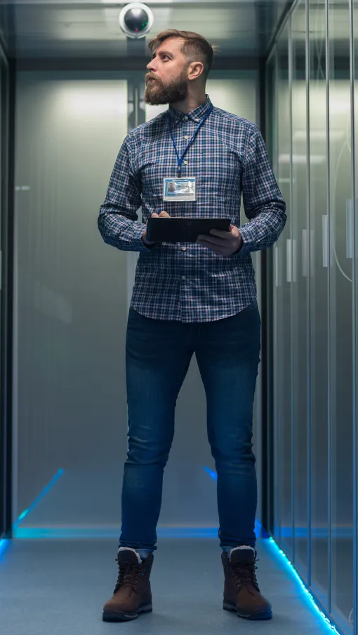 a person standing in a room with lockers