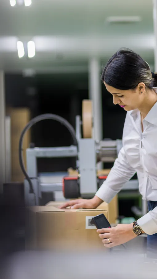 a woman scanning a box