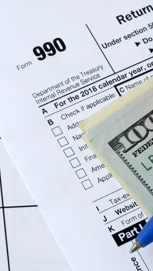 money laying on a tax form