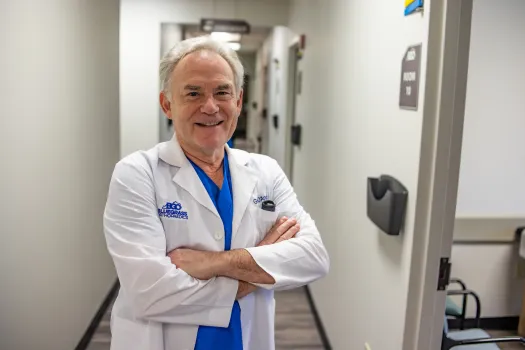 a man in a white coat