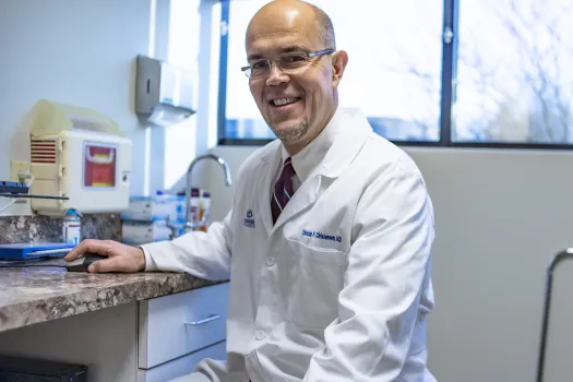 a man in a white coat