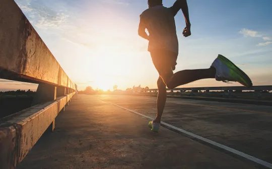 a person running on a bridge