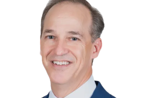 a man in a suit smiling