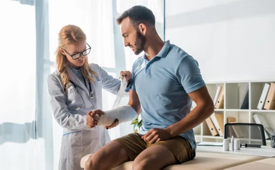a man and a woman looking at a arm wrap