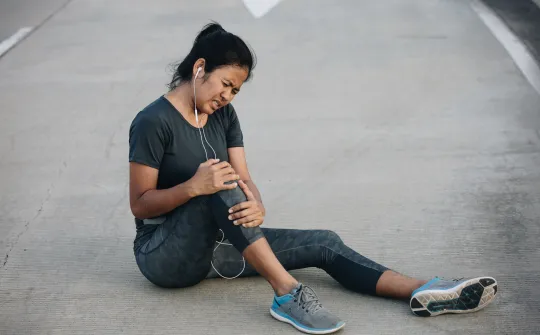 a woman sitting on the ground
