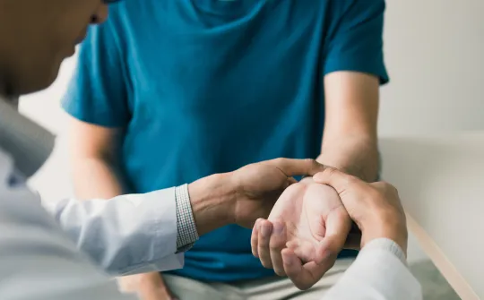 a person holding a person's hand
