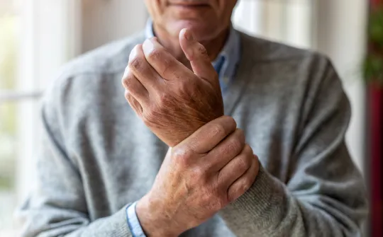 a man holding his hands together