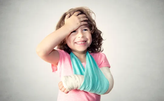 a girl holding her head