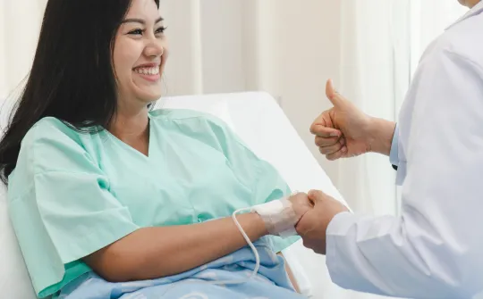 a patient smiling at the doctor