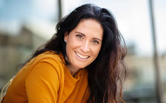 a woman smiling at the camera