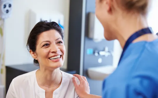 a doctor talking to a patient