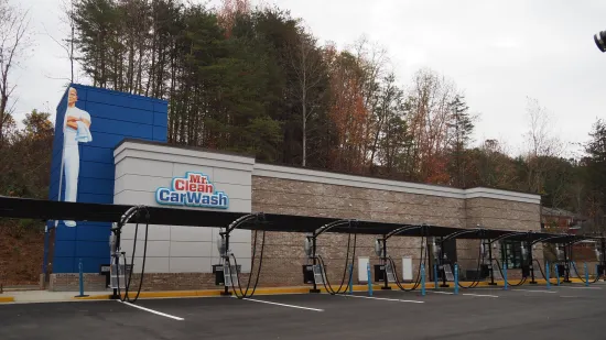 mr. clean car wash lot and buidling with two signs