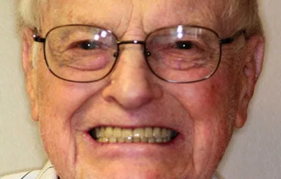 Smiling elderly man wearing glasses in top photo and close-up of clean white teeth in bottom photo.