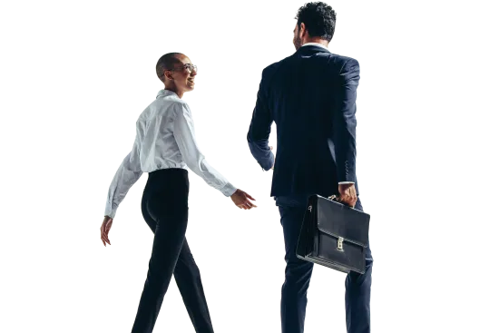 Two business professionals walking, one carrying a briefcase, dressed in formal attire, isolated on white.