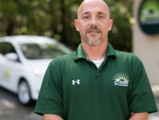 a man in a green shirt