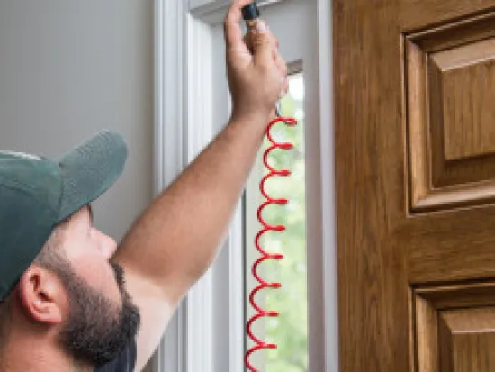 a man standing in front of a window