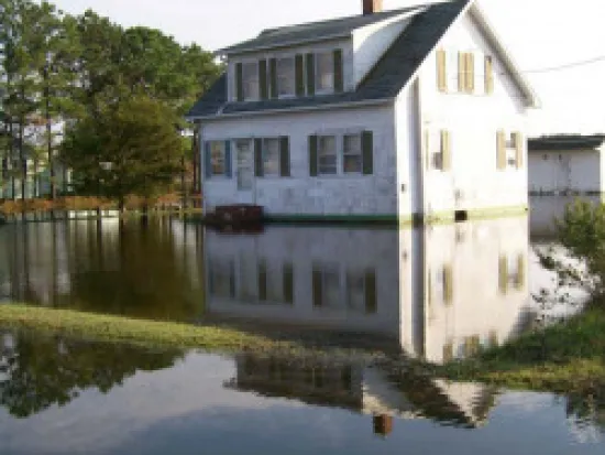 a small house in a body of water