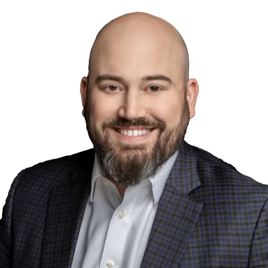 a man with a beard smiling