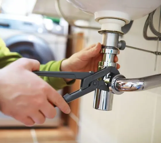 a person using a faucet