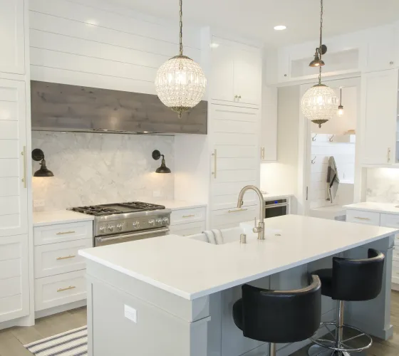 a kitchen with white cabinets