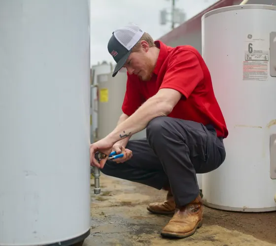 Plumbing Expert Servicing Water Heater in Cartersville