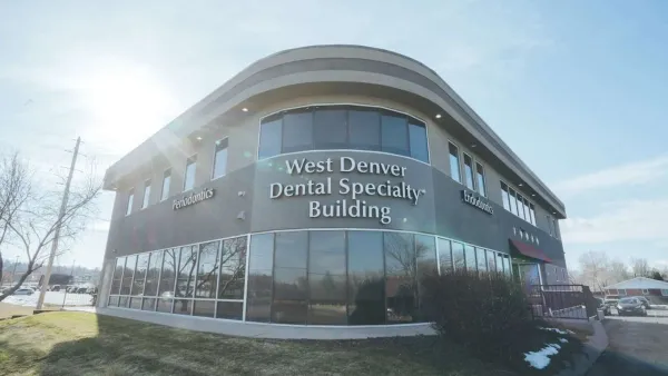 Modern West Denver Dental Specialty Building with large windows and clear blue sky on a sunny day.