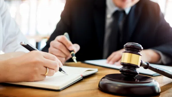 Talking to a lawyer about nonpayment of child support.