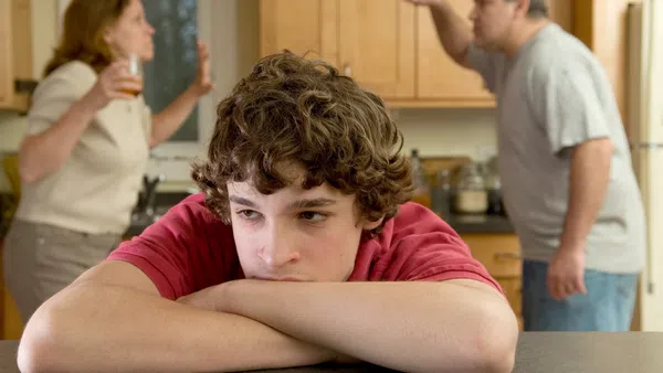 a young boy sitting on a table
