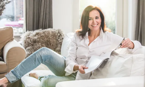a woman sitting on a couch
